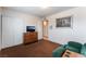 A bedroom with a closet, media center, and neutral walls provides a peaceful and comfortable retreat at 704 N Wallace Dr, Las Vegas, NV 89107