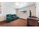 A comfortable bedroom with a couch and media center for relaxation and entertainment at 704 N Wallace Dr, Las Vegas, NV 89107