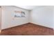 The empty bedroom offers ample natural light and a blank canvas for personalization and creativity at 704 N Wallace Dr, Las Vegas, NV 89107