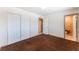 A bedroom featuring natural light, a closet, and an attached bathroom provides comfort and convenience at 704 N Wallace Dr, Las Vegas, NV 89107