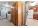 Well-equipped laundry room with storage cabinets and appliances at 704 N Wallace Dr, Las Vegas, NV 89107