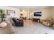 Comfortable living room featuring tile flooring and an open layout, perfect for relaxation at 704 N Wallace Dr, Las Vegas, NV 89107