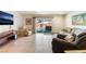 Relaxing living room featuring sliding glass door access to the private pool area at 704 N Wallace Dr, Las Vegas, NV 89107