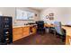 This office offers ample workspace, a comfortable chair, and storage, perfect for productivity and organization at 704 N Wallace Dr, Las Vegas, NV 89107