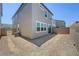 Exterior view of the backyard showing the home's structure and the surrounding space at 7086 Parkallen Ave, Las Vegas, NV 89113