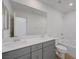 Modern bathroom showcasing a double sink vanity, large mirror, and a shower-tub combo at 7086 Parkallen Ave, Las Vegas, NV 89113