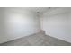 Sunlit bedroom offers plain walls and a connecting door at 7086 Parkallen Ave, Las Vegas, NV 89113