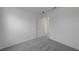 Bright bedroom featuring neutral carpet, baseboards and fresh white paint at 7086 Parkallen Ave, Las Vegas, NV 89113