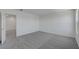 Bonus room features neutral carpet and an open doorway to the staircase at 7086 Parkallen Ave, Las Vegas, NV 89113