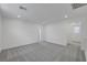 Spacious bonus room features neutral carpet, recessed lights, and ample natural light at 7086 Parkallen Ave, Las Vegas, NV 89113