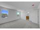 Bright bonus room with neutral carpet features recessed lighting and two windows at 7086 Parkallen Ave, Las Vegas, NV 89113