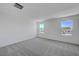 Bonus room with large windows offers plenty of natural light and neutral carpet at 7086 Parkallen Ave, Las Vegas, NV 89113