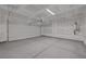 Spacious garage with ample room for parking and storage, and a modern garage door at 7086 Parkallen Ave, Las Vegas, NV 89113