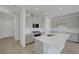 A spacious kitchen with stainless steel appliances, white countertops, and a large island at 7086 Parkallen Ave, Las Vegas, NV 89113