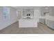 A spacious kitchen with stainless steel appliances, white countertops, and a large island at 7086 Parkallen Ave, Las Vegas, NV 89113