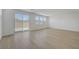 Open living room with natural light, wood floors and backyard access at 7086 Parkallen Ave, Las Vegas, NV 89113