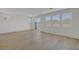 Bright and spacious living room featuring modern wood flooring and a sliding glass door at 7086 Parkallen Ave, Las Vegas, NV 89113