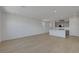 Bright living space with open floor plan, wood-style flooring, and recessed lighting at 7086 Parkallen Ave, Las Vegas, NV 89113