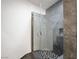 Modern bathroom featuring a glass-enclosed shower with sleek tile and contemporary fixtures for a spa-like experience at 7215 Ullom Dr, Las Vegas, NV 89118