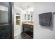 Elegant bathroom featuring a stylish vanity with granite countertops and modern fixtures, perfect for daily routines at 7215 Ullom Dr, Las Vegas, NV 89118