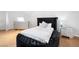 Stylish bedroom with a plush bed, sleek dresser, and elegant nightstand, creating a luxurious retreat at 7215 Ullom Dr, Las Vegas, NV 89118
