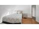 Charming bedroom featuring a cozy bed, hardwood floors, and a modern nightstand for comfortable living at 7215 Ullom Dr, Las Vegas, NV 89118