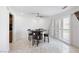 Dining area features tile flooring, a round table with a unique barrel base and sliding doors at 7215 Ullom Dr, Las Vegas, NV 89118