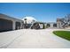 Unique dome home with a paved driveway and attached garages, manicured lawn and desert landscaping at 7215 Ullom Dr, Las Vegas, NV 89118