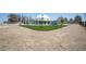 View of the unique dome-shaped home featuring a large gravel lot with tasteful landscaping at 7215 Ullom Dr, Las Vegas, NV 89118