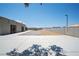 Expansive lot featuring large paved parking and uniquely designed home with block wall at 7215 Ullom Dr, Las Vegas, NV 89118