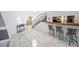 Foyer area with tile floors and staircase leading to a bar area with chairs at 7215 Ullom Dr, Las Vegas, NV 89118