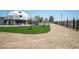 Artificial turf and drought-resistant landscaping enhance the property's curb appeal and conserves water at 7215 Ullom Dr, Las Vegas, NV 89118