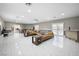 Expansive living area with tile flooring, comfortable seating, and ample natural light at 7215 Ullom Dr, Las Vegas, NV 89118
