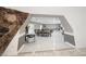 Open concept living space featuring stone accent wall and tile flooring at 7215 Ullom Dr, Las Vegas, NV 89118