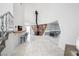 Living room showcasing a wood burning stove, bar area, and tile flooring at 7215 Ullom Dr, Las Vegas, NV 89118