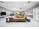 Spacious living room with tile floors, recessed lighting, and modern furnishings at 7215 Ullom Dr, Las Vegas, NV 89118