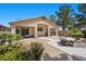 Inviting backyard with lush greenery, a concrete patio, and comfortable outdoor seating at 8021 Glacier Falls St, North Las Vegas, NV 89085