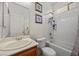 Bright bathroom featuring a vanity with a sink, a toilet, and a shower over tub at 8021 Glacier Falls St, North Las Vegas, NV 89085