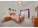 Cozy bedroom with a four-poster bed, matching nightstands, and soft lighting at 8021 Glacier Falls St, North Las Vegas, NV 89085