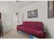 This bedroom features neutral walls, a futon, and tasteful wall art at 8021 Glacier Falls St, North Las Vegas, NV 89085