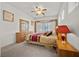Well-lit bedroom features a ceiling fan and cozy decor with a large window at 8021 Glacier Falls St, North Las Vegas, NV 89085