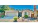 Charming single-story home with a well-manicured front yard and attached two-car garage at 8021 Glacier Falls St, North Las Vegas, NV 89085