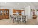 Kitchen view with island seating, wood cabinets, and an open floor plan at 8021 Glacier Falls St, North Las Vegas, NV 89085