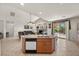 Open-concept kitchen with a large island, modern appliances, and seamless flow to the living area at 8021 Glacier Falls St, North Las Vegas, NV 89085