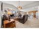 Spacious living room with a vaulted ceiling, entertainment center, and comfortable leather seating at 8021 Glacier Falls St, North Las Vegas, NV 89085