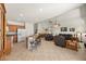 Expansive living area features a kitchen island, dining area, and comfortable seating arrangements at 8021 Glacier Falls St, North Las Vegas, NV 89085