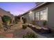 Cozy backyard with gravel, stone pavers, and view to the home's windows at 816 Stannard Ct, Henderson, NV 89052