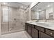 Elegant bathroom with double vanity, walk-in shower, and modern fixtures at 816 Stannard Ct, Henderson, NV 89052