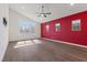 Spacious bedroom with hardwood floors, ceiling fan, and large windows at 816 Stannard Ct, Henderson, NV 89052