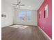 Bright bedroom with hardwood floors, ceiling fan, and ample natural light at 816 Stannard Ct, Henderson, NV 89052
